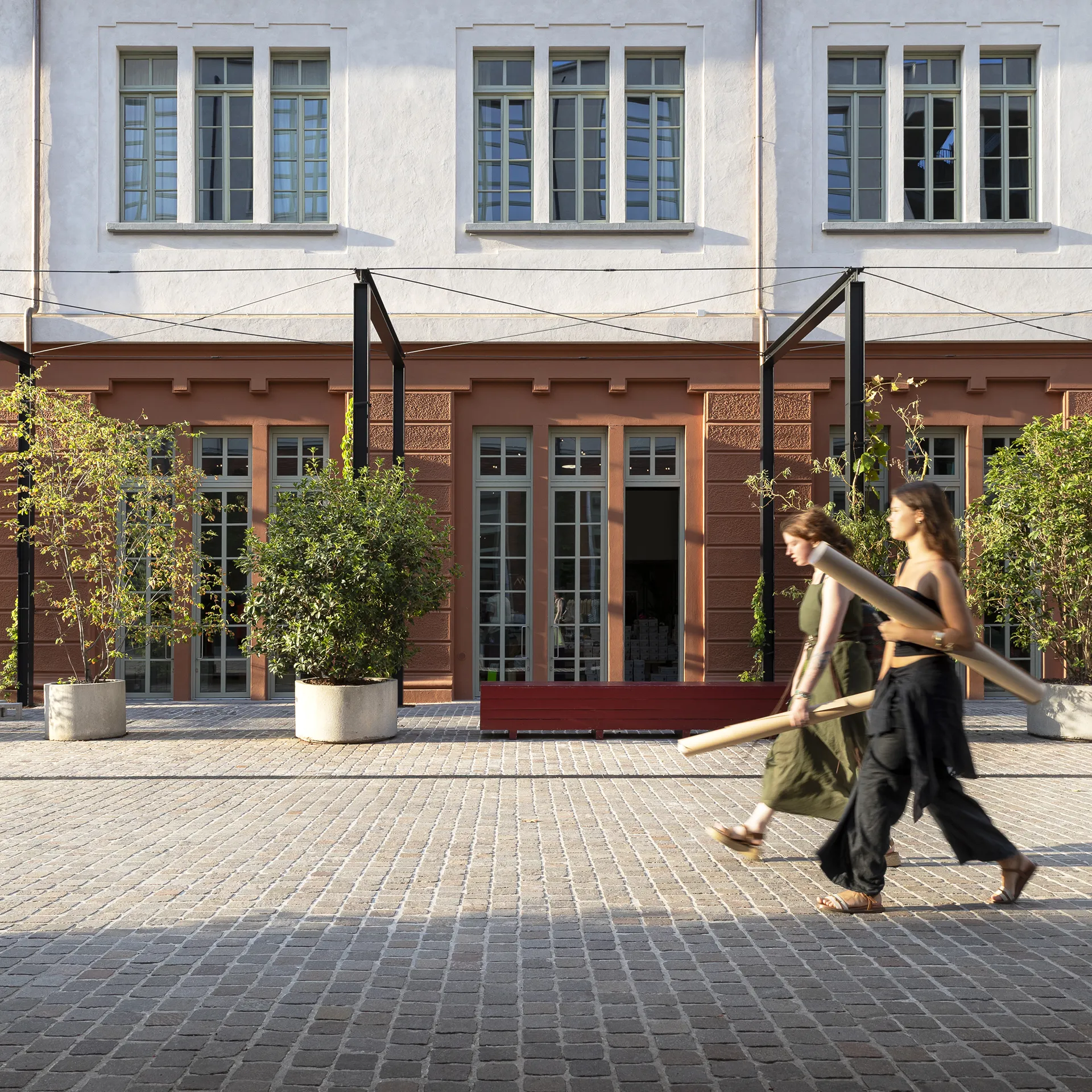 People enjoying the urban spaces around Manifattura Tabacchi
